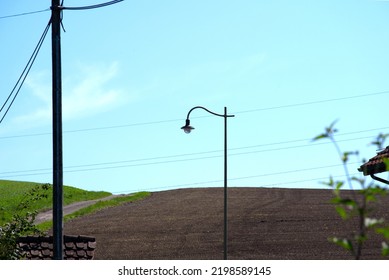 Scenic View Of Rural Landscape With Streetlight And Power Line At Hamlet Ettenhausen, Canton Zürich, On A Sunny Late Summer Day. Photo Taken September 2nd, 2022, Ettenhausen, Switzerland.