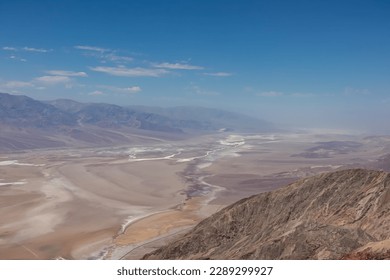 Scenic view of Salt Badwater Basin and Panamint Mountains seen from Dante View in Death Valley National Park, California, USA. Coffin Peak, along crest of Black Mountains, overlooking desert landscape
