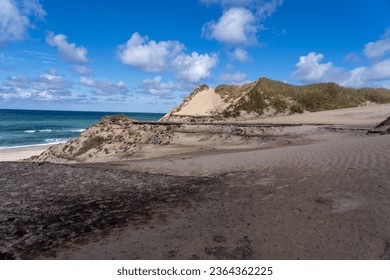 A scenic view of a sandy beach with the crystal-clear sea in Nationalpark Thy in Denmark.