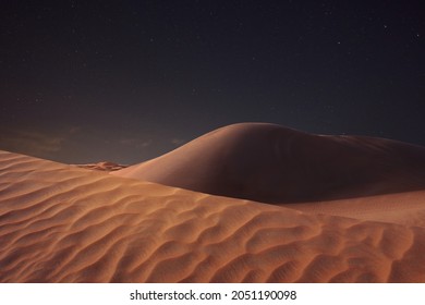 Scenic View Of Sandy Desert Under Starry Sky In Night 