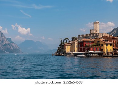 Scenic view of Scaliger Castle in lakeside town Malcesine, Veneto, Northern Italy. Tranquil atmosphere on Garda Lake surrounded by majestic rugged mountains and cliffs of Garda Hills. Summer vacation - Powered by Shutterstock