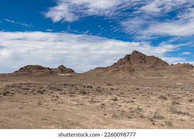 Scenic view of sharp mountain of Volcano Peak in the Silver Island Mountain range near the Bonneville Salt Flats in Wendover, Western Utah, USA, America. Barren deserted landscape near Salt Lake City