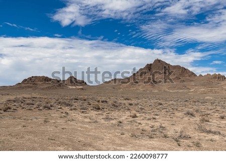 Scenic view of sharp mountain of Volcano Peak in the Silver Island Mountain range near the Bonneville Salt Flats in Wendover, Western Utah, USA, America. Barren deserted landscape near Salt Lake City