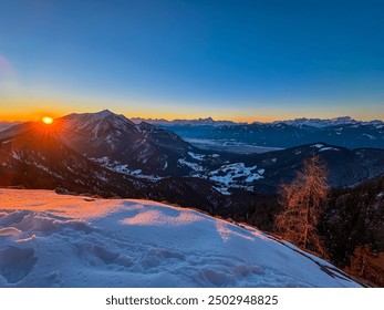 Scenic view of snow capped mountain peak Dobratsch and Julian Alps at sunrise seen from Kobesnock, Bad Bleiberg, Carinthia, Austria. Remote wilderness. Snow covered winter wonderland, Austrian Alps - Powered by Shutterstock