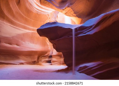 A scenic view of sunlight beaming through the crack in the Antelope Canyon, Arizona - Powered by Shutterstock