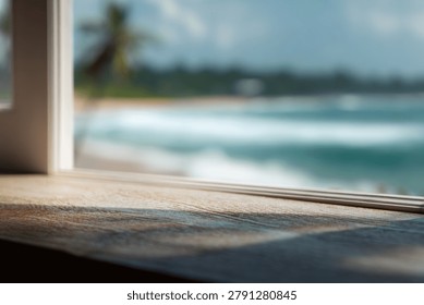 Scenic view through window featuring ocean waves and palm trees.