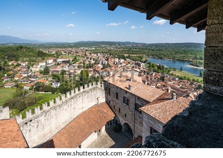 Scenic view from the top of Rocca di Angera on the shores of Lake Maggiore and surrounded by a beautiful countryside. Angera, Lombardy, Italy, Apr. 2022