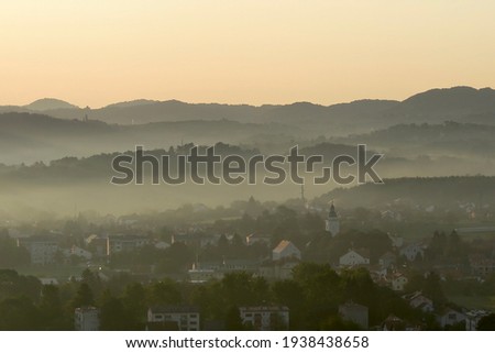 A scenic view of the town of Donja Stubica from a hill above it in the early autumn morning Stock photo © 