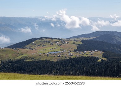 Scenic View of a Trabzon Highland Village: Lush Green Fields, Pine Forests, Rolling Hills, and a Tranquil Lake Amidst the Clouds - Powered by Shutterstock