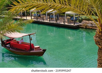 Scenic View Of Traditional Arab Abra-boat On Turquoise Water Of Madinat Jumeirah Canal. Dubai Tourist Ferry Luxury Boat Taxi.Dubai,UAE.Aug.2022