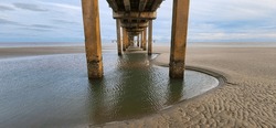 A Scenic View Underneath A Pier On The Gulf Of Mexico In Galveston, Texas.