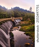 A scenic view of the Vale das Antas hydroelectric dam in Poços de Caldas, showcasing its large concrete structure, surrounding nature, and water reservoir.