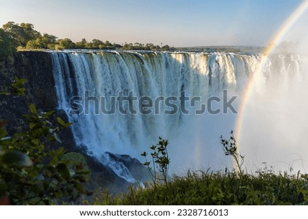 Scenic view of Victoria Falls with rainbow in Matabeleland North Province, Zimbabwe