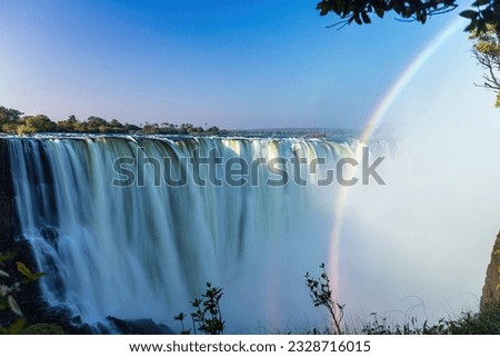 Scenic view of Victoria Falls with rainbow in Matabeleland North Province, Zimbabwe