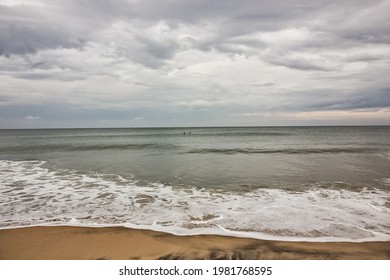 Scenic view of the waves hitting the beach on a cloudy overcast day in the village of Varkala in Kerala, India. - Powered by Shutterstock