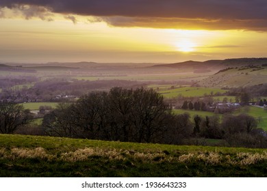 scenic Westerly view as the golden sun sets over Oare and across the Pewsey Vale valley, North Wessex Downs AONB - Shutterstock ID 1936643233