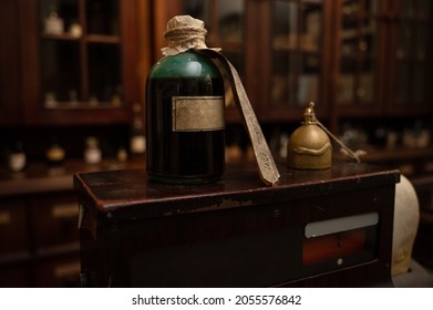 Scent Bottles In Old Pharmacy. Wooden Antique Old Pharmacy Furniture For Medical Drug Storage