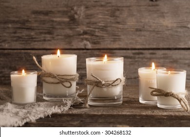 Scented Candles On Old Wooden Background