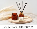Scented Candles and Reed Diffuser on a Wooden Tray