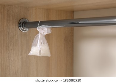 Scented Sachet Hanging On Metal Bar In Wardrobe