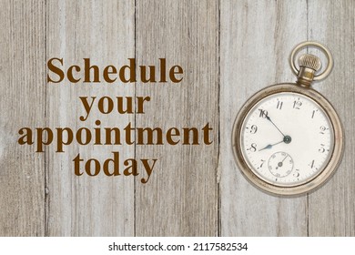 Schedule your appointment now message with old retro pocket watch on weathered wood - Shutterstock ID 2117582534