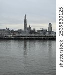 Schelde river views in the province of Antwerp on a cold winter day. Grey day in Antwerp. Riverside looking towards the city of Antwerp. River and city. 