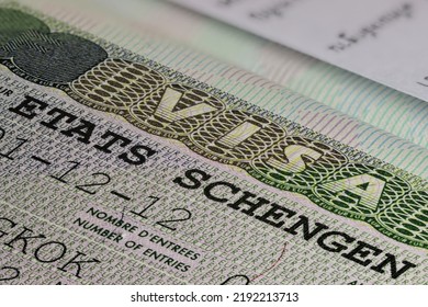 Schengen States visa in passport - Shutterstock ID 2192213713