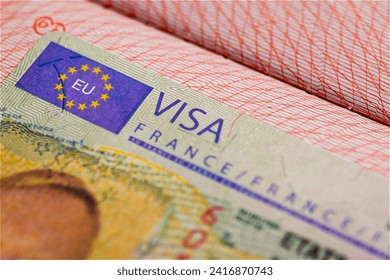Schengen visa of France in the passport, closed border of EC. Close-up