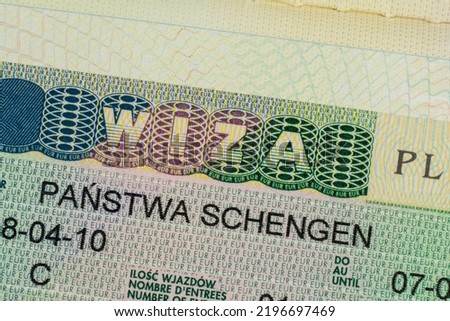 Schengen visa in the passport close-up. Polish visa. 