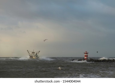 Scheveningen, The Hague, January 2018. This was the first ship to sail from the harbour after the first January storm had abated a little.This was just passing the lighthouse at the harbour head.