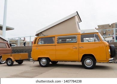 Scheveningen, The Hague, the Netherlands - 1960s style VW Transporter  Kombi with trailer parked at Scheveningen beach