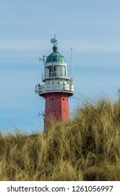 Scheveningen, the Netherlands - March 12 207: historic dutch lighthouse on the dunes of Scheveningen beach serving as a navigation aid to fishermen and sea travellers