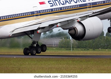 Schiphol, Amsterdam Netherlands - May 11 2022: Image Of A Singapore Airlines Boeing 777 Passenger Plane Taking Off From Schiphol Airport With 2 Wheels On The Ground And Full Throttle.
