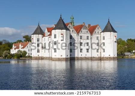 Schloss Glücksburg, one of the most important Renaissance castles in Northern Europe. Glücksburg in Schleswig-Holstein, Germany. With reflection in the water.