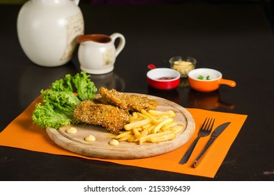 Schnitzel with french fries and a spicy dip. Escalope is a dish of oriental or Arabic cuisine.
