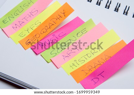 Scholar subjects written on coloured notes 