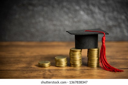Scholarships education concept with graduation cap on coin money saving  for grants education on wooden table dark background  - Shutterstock ID 1367838347
