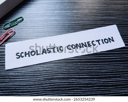 Scholastic connection writting on table background.