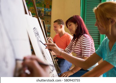 School Of Art, College Of Arts, Education For Group Of Young Students. Happy Latina Woman Smiling, Girl Learning To Paint.