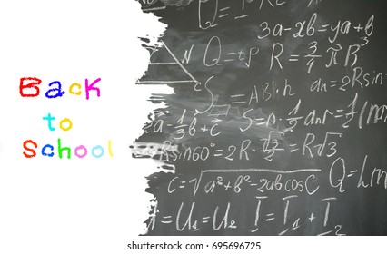 school background with math formulas written in white chalk on black board border with copy space