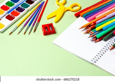 School background. Various school supplies on a desktop, copy space