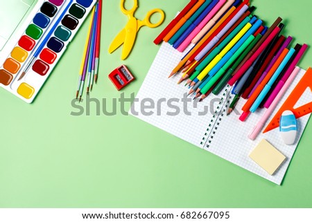 School background. Various school supplies on a desktop, copy space