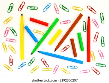 School Background Wallpaper With Paper Clips And Colored Felt-tip Pens Close-up On A White Background For Design