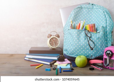 School Backpack With Coloured Pencil And School Supplies On Brown Wood Table Background. Back To School Concept.