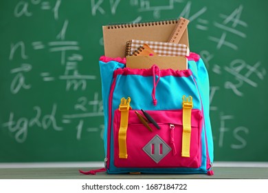 School backpack on table in classroom