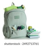 School backpack with stationery, apple and books isolated on white background