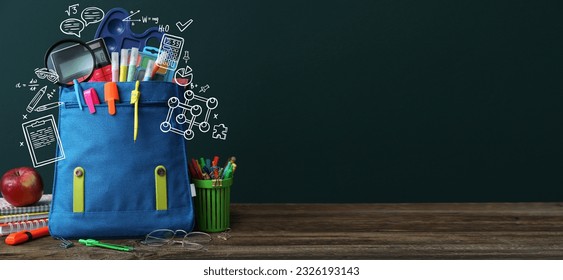 School backpack with stationery on table in classroom. Banner for design