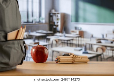 School backpack and school stuff with space for products on wooden desk in  classroom interior. Chalkboard wall background. Back to school. Copy space for school supplies and accessories. - Powered by Shutterstock