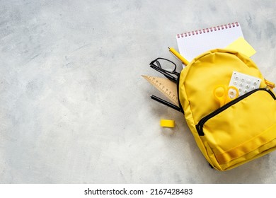 School Bag With With Colorful School Items, Top View