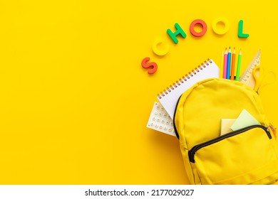 School Bag With With Colorful School Items, Top View